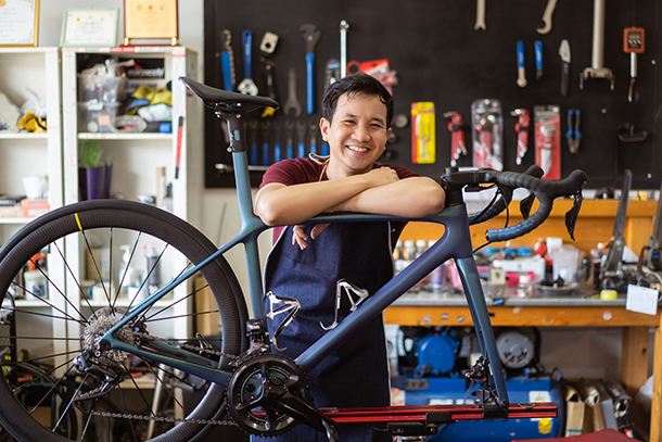 Bike shop owner working on a bicycle